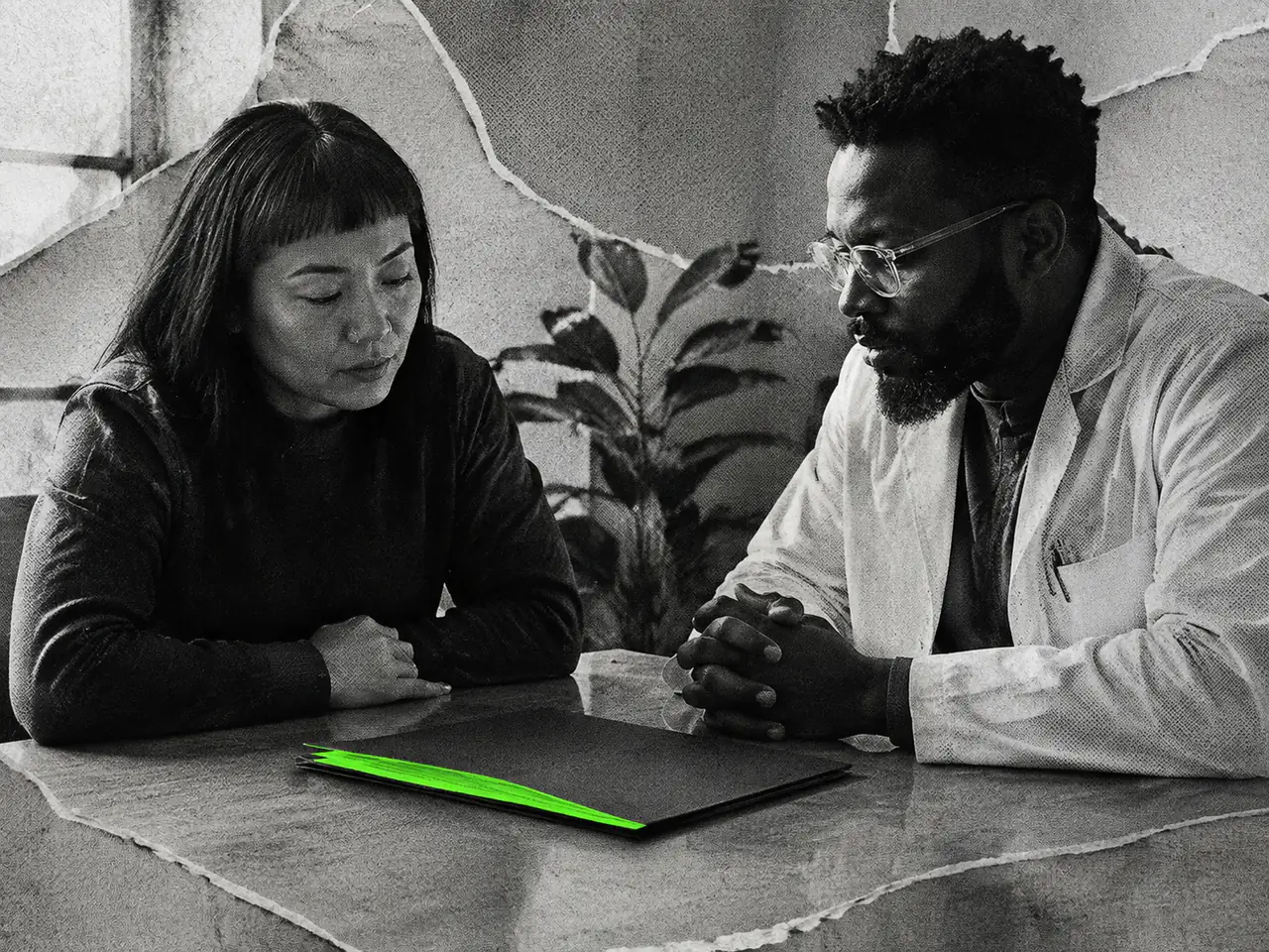 A patient and clinician sit beside a closed dark folder with a green folded edge.